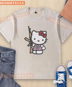 Cute Hello Kitty holding an AK-47 rifle on a washed t-shirt, blending playful design with edgy style.