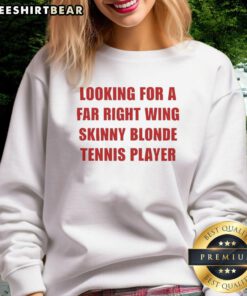 Stylish far-right wing skinny blonde tennis player wearing a trendy sweatshirt on the court.