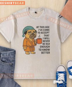Alt Text: Pug washed t-shirt with the quote about embracing youth and wisdom, ideal for casual, playful fashion lovers.