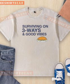 Alt Text: Official Cincinnati Chili Surviving on 3 Ways and Good Vibes washed t-shirt showcasing vibrant design and casual style.