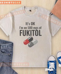 Funny washed t-shirt featuring 'It's OK, I'm on 500 mg of Fukitol' text, perfect for humor lovers and casual wear.