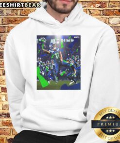 Alt Text: Jaxon Smith-Njigba in Seattle Seahawks Super Bowl LX Champions 2026 hoodie, celebrating victory on the field.