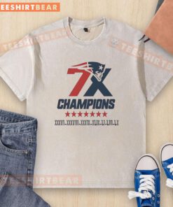 Alt Text: Official New England Patriots 7x Super Bowl Champions logo on a washed t-shirt, perfect for fans and collectors.