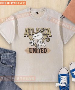 Alt Text: Official Peanuts Snoopy X Atlanta United washed t-shirt featuring a playful Snoopy design and team colors.