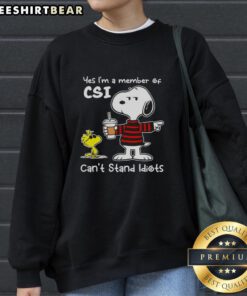 Alt Text: Official Peanuts Snoopy sweatshirt featuring 'Yes, I'm a member of CSI, can't stand idiots' design.