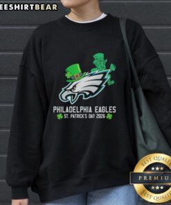 Official Philadelphia Eagles Football X St. Patrick's Day 2026 Sweatshirt featuring festive green design and team logo.