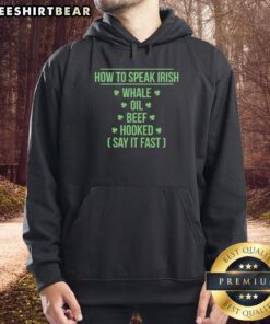 Premium St. Patrick's Day hoodie featuring 'Whale Oil Beef Hooked' phrase for festive Irish celebrations.