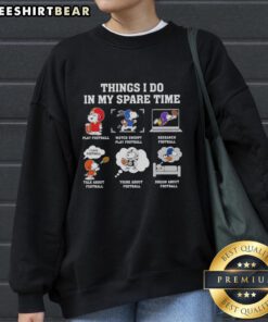Alt Text: Cozy 'Pretty Things I Do In My Spare Time' Snoopy sweatshirt featuring Snoopy playing football, perfect for casual wear.