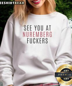 Alt Text: Top Abolish ICE sweatshirt featuring 'See You at Nuremberg, Fuckers' slogan, perfect for activism and awareness.