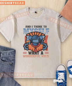 Alt Text: Top And I Think To Myself What A Wonderful Weld Washed T-Shirt in a vibrant color, showcasing a relaxed fit and unique design.