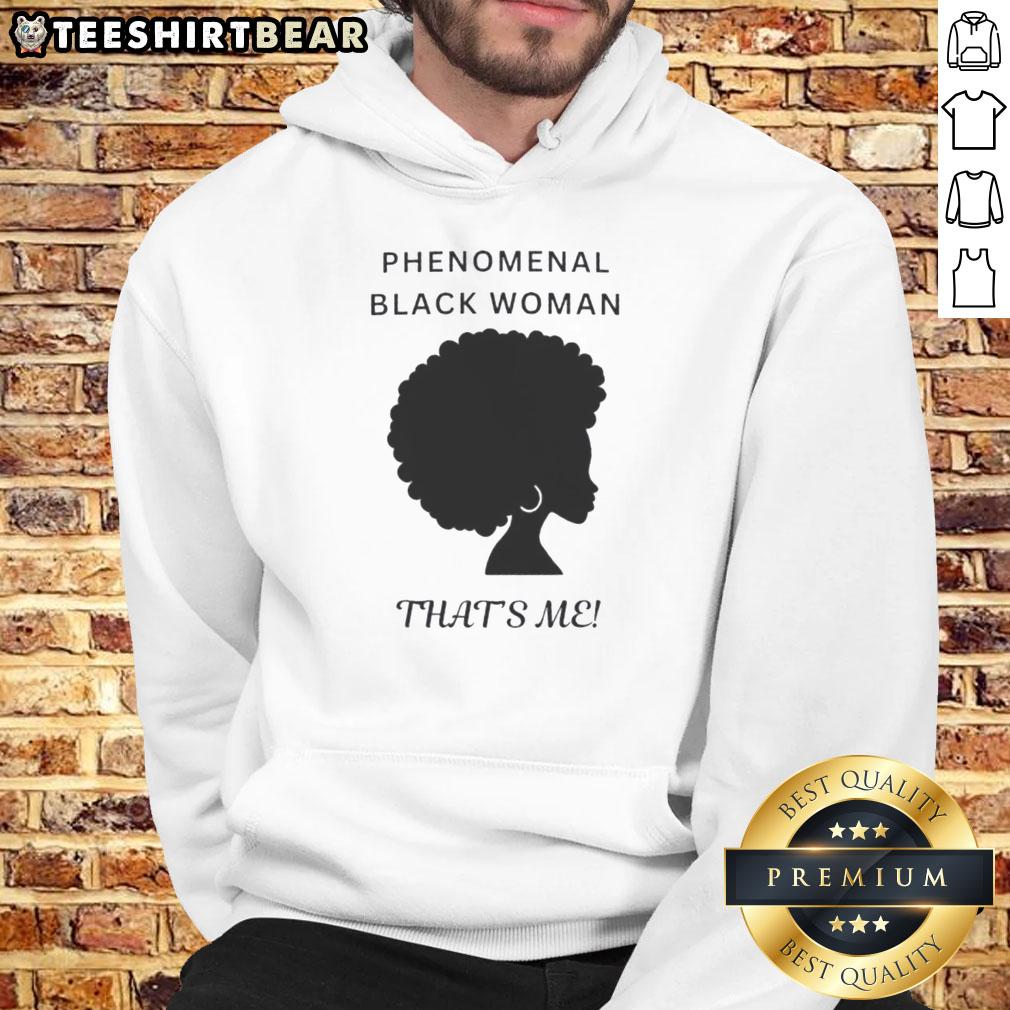 Black woman wearing a 'Top Phenomenal Woman' hoodie, embodying strength and confidence in a stylish urban setting.