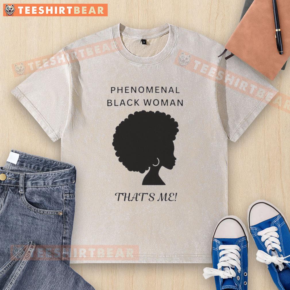 Black woman wearing a 'Top Phenomenal Woman' washed t-shirt, exuding confidence and style in a casual setting.