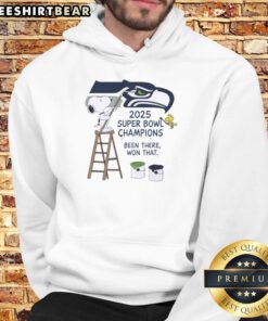 Top Snoopy and Woodstock drawing on Seattle Seahawks 2025 Super Bowl Champions hoodie, celebrating their victory.