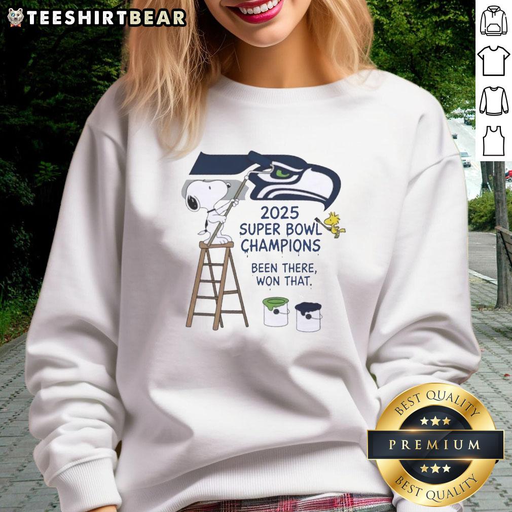 Alt Text: Snoopy and Woodstock drawing on a Seattle Seahawks sweatshirt celebrating 2025 Super Bowl Champions.