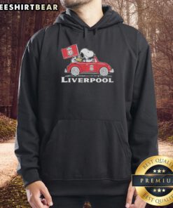 Alt Text: Snoopy and Woodstock driving a Liverpool FC red car while raising a flag, wearing a stylish hoodie.