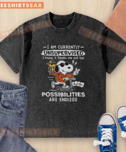 Alt Text: Snoopy and Woodstock joyfully riding a scooter on a washed T-shirt with I Am Currently Unsupervised text.