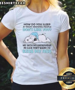 Alt Text: Snoopy graphic on a ladies tee with the phrase 'How Do You Sleep At Night Knowing People Don't Like You'.