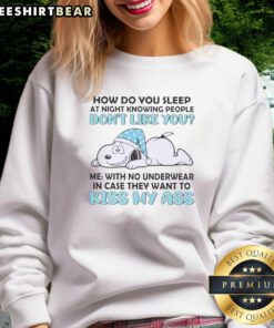 Snoopy sweatshirt with 'How Do You Sleep At Night Knowing People Don't Like You?' design, perfect for fans.