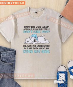 Top Snoopy t-shirt featuring the phrase 'How Do You Sleep At Night Knowing People Don't Like You' in a fun design.