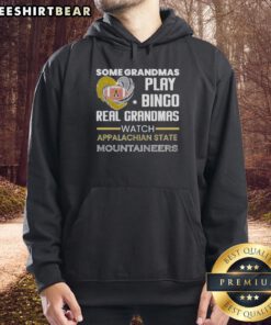 Grandmas in cozy Appalachian State Mountaineers hoodies enjoy bingo night, showcasing team spirit and fun.