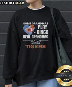 Funny sweatshirt design: 'Real Grandmas Watch Auburn Tigers' with bingo theme, perfect for Auburn fans and grandmas.