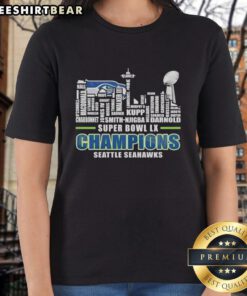 Seattle Seahawks Super Bowl LX Champions trophy graphic on ladies tee with city skyline and team names.