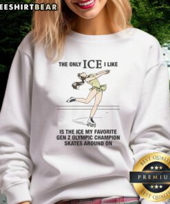 Gen Z Olympic champion skates on ice in stylish sweatshirt: 'The Only Ice I Like Is The Ice.' Perfect for winter sports fans!