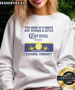 White boy wearing a 'Corona Extra' sweatshirt, showcasing casual style and trendy streetwear fashion.