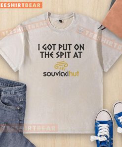 Good I Got Put On The Spit At Souvlakihut washed t-shirt displayed on a rustic wooden background.