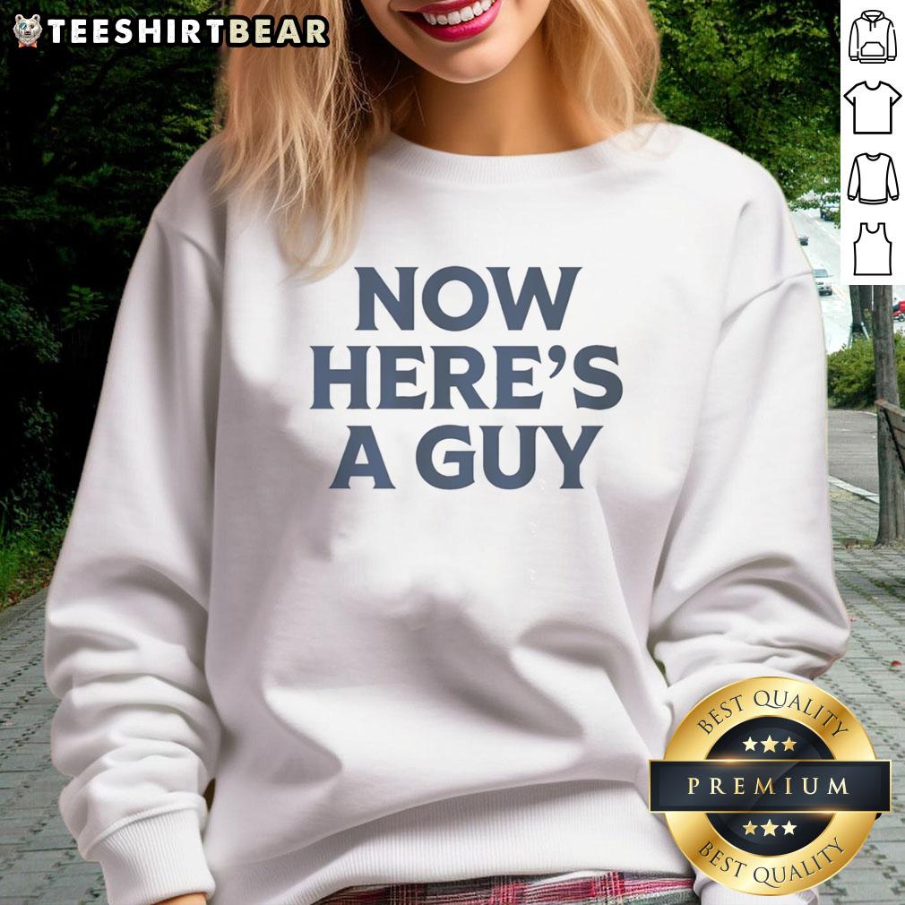 Casual man wearing a blue text sweatshirt with 'Good Now' printed, showcasing trendy streetwear style.