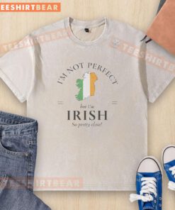 Hot I'm Not Perfect But I'm Irish So Pretty Close washed t-shirt design with vibrant colors and playful typography.