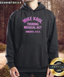 Hot Mike Krol touring musical act in America wearing a stylish hoodie, performing with energy on stage.