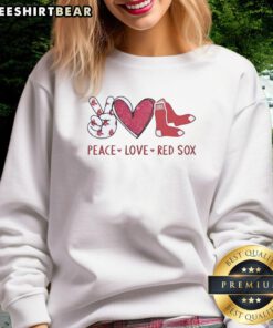 Alt Text: Boston Red Sox sweatshirt featuring a heart-shaped hand sign and logo, promoting peace and love for the team.