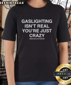 Funny ladies' tee featuring 'Gaslighting isn't real, you're just crazy' slogan, perfect for humor and awareness.