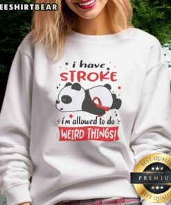 Cute panda in a red ribbon sweatshirt, showcasing its playful side with a funny pose and relaxed demeanor.