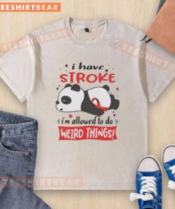 Lazy panda wearing a red ribbon on a washed T-shirt, showcasing its quirky personality and charm in a playful pose.