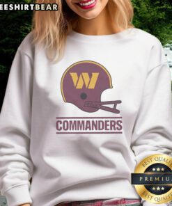 Alt Text: Stylish sweatshirt featuring the Washington Commanders football logo on a large helmet design. Perfect for fans!