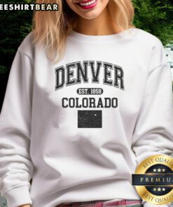 Alt Text: Official Denver Colorado Est 1858 varsity sweatshirt showcasing a classic design in navy blue and gold colors.
