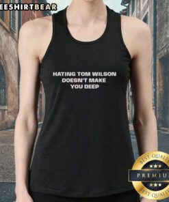 Official Hating Tom Wilton Doesn't Make You Deep Tank Top featuring bold graphic design on a stylish black tank.