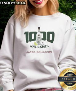 Jared Spurgeon 1000 NHL Games sweatshirt featuring team colors and logo, celebrating his milestone in professional hockey.