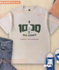Official Jared Spurgeon 1000 NHL Games washed t-shirt featuring team colors and logo, perfect for hockey fans.