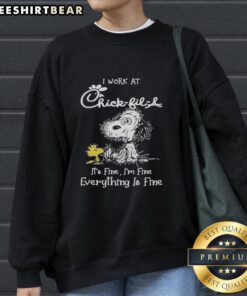 Cozy Official Snoopy and Woodstock sweatshirt from Chick-fil-A, featuring 'I Work At It's Fine I'm Fine Everything Is Fine' design.