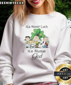 St. Patrick's Day sweatshirt featuring Peanuts characters with 'It's Never Luck, It's Always God' design.