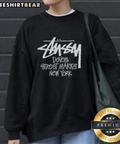 Premium Dover Street Market New York sweatshirt displayed on a stylish hanger against a minimalist background.