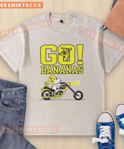 Premium Snoopy and Woodstock driving on a Savannah with bananas, featuring a fun washed t-shirt design.