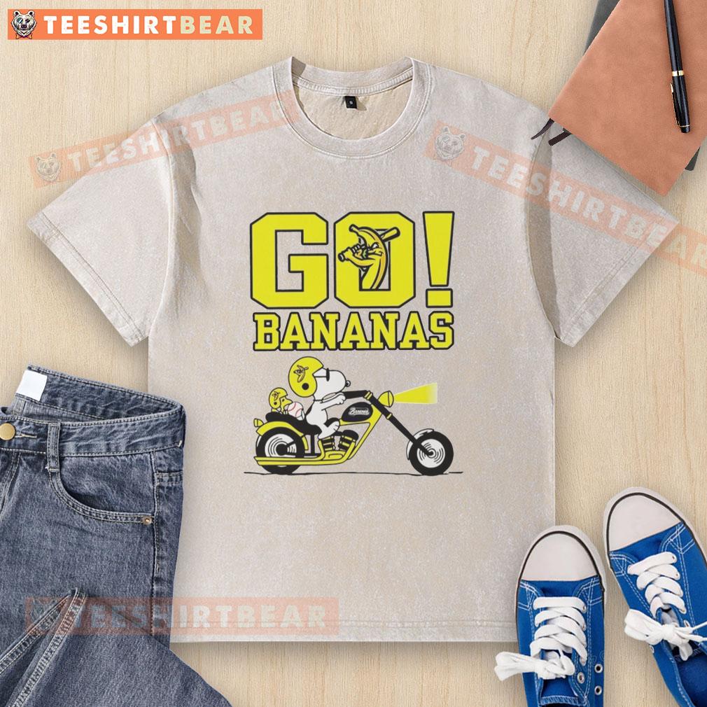 Premium Snoopy and Woodstock driving on a Savannah with bananas, featuring a fun washed t-shirt design.