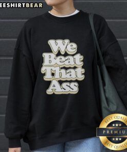 Premium USF Mens 'We Beat That Ass' Sweatshirt in green, showcasing sporty style and comfort for fans.