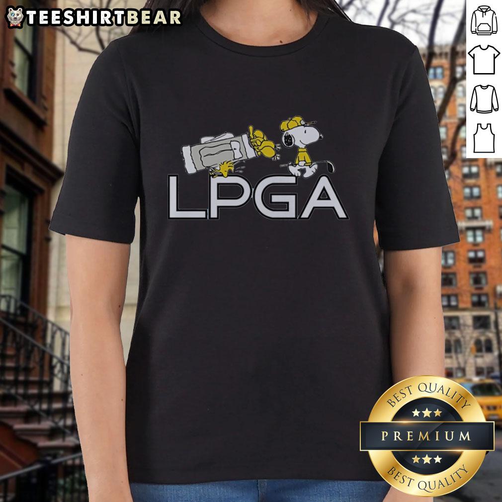 Alt Text: Pretty Snoopy and Woodstock holding a pocket golf tee from Peanuts X LPGA for ladies' golf enthusiasts.