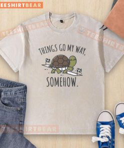 Alt Text: Cute turtle race graphic on a washed t-shirt from Pretty Things Go My Way, perfect for casual wear.