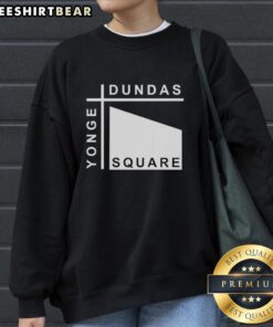 Stylish Pretty Yonge Dundas Square sweatshirt displayed against a vibrant urban backdrop, perfect for city fashion.